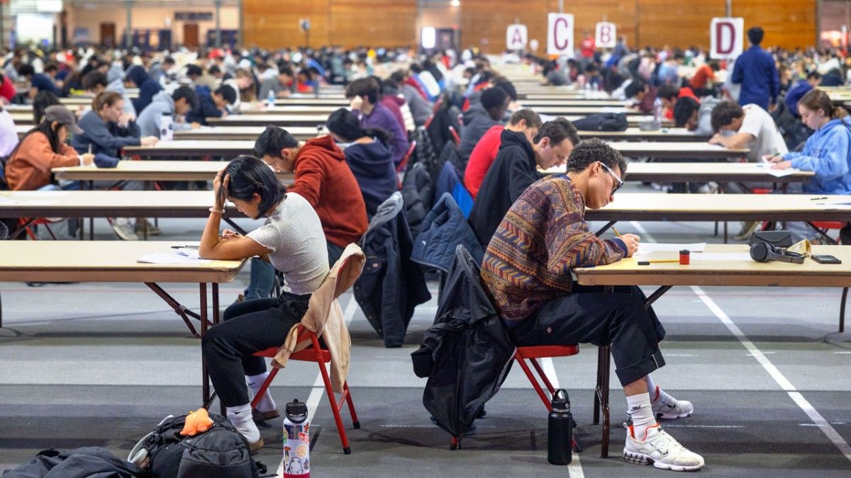 Cornell students taking an exam in Barton hall