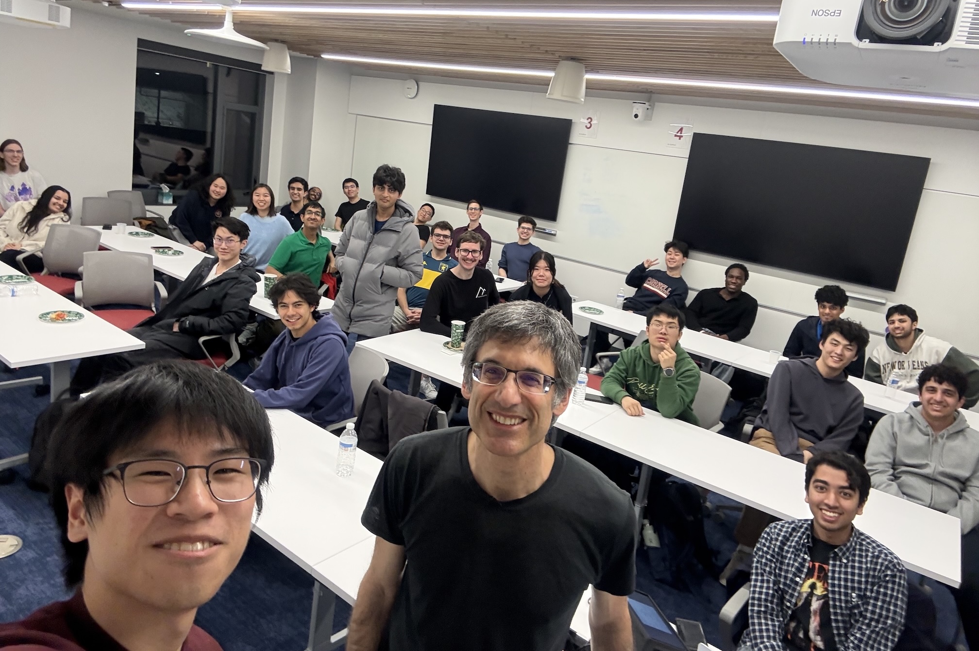 Theory club members sitting in a classroom after Prof. Bobby Kleinberg's talk.